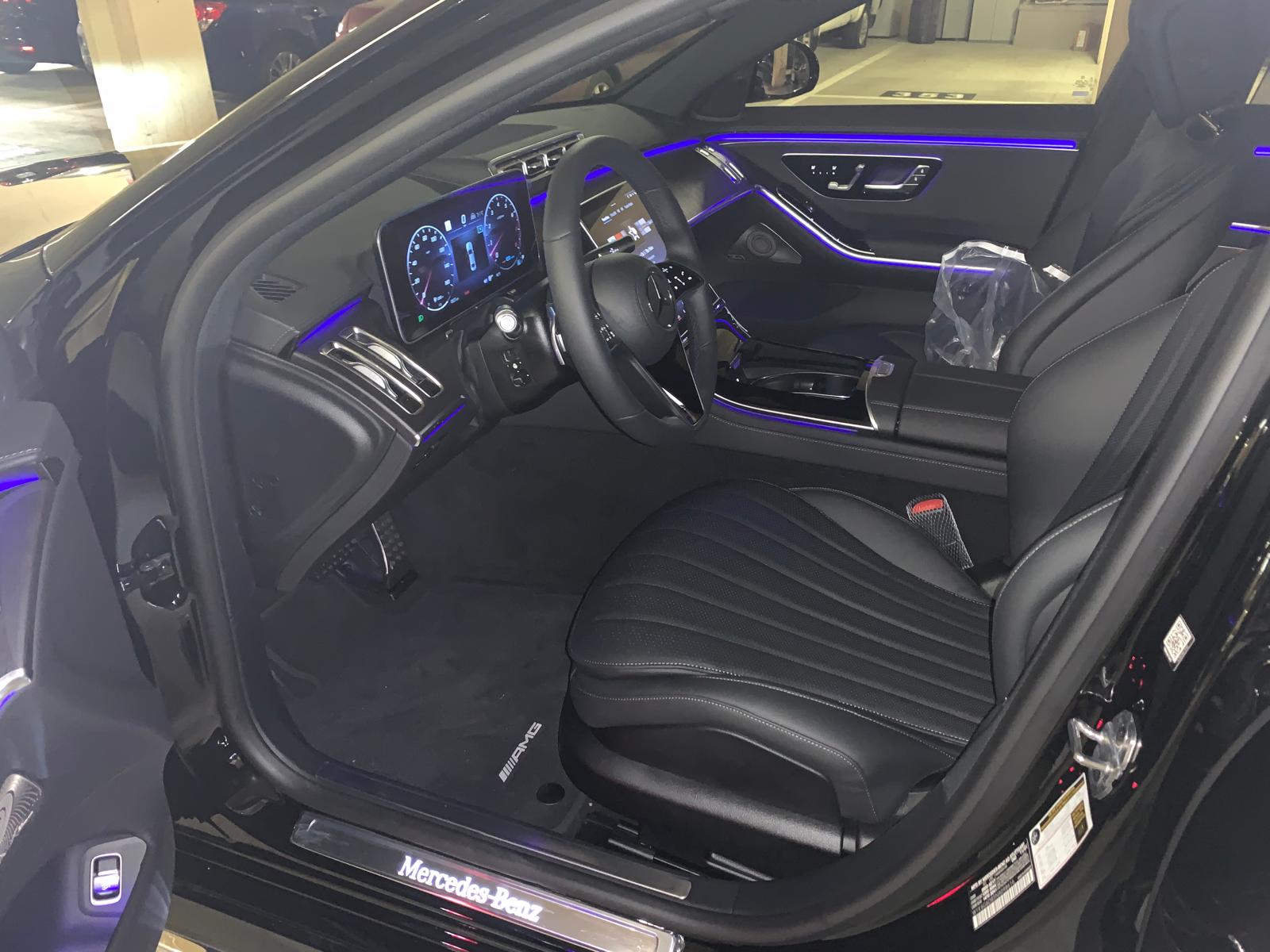 Mercedes-Benz S-Class front cabin with digital dashboard and blue ambient lighting